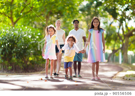 Family in summer park. Parents and kids outdoor. 90556506
