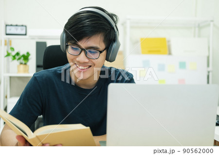 Young man study in front of the laptop computer at home Young man study in front of the laptop computer at home 90562000