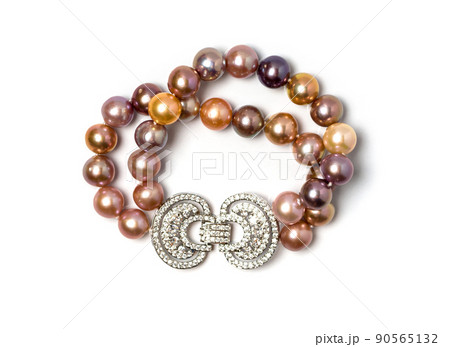 Double strand freshwater pearl bracelet on white background. Collection of luxury jewelry accessories. Studio shot 90565132