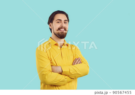 Portrait of handsome and happy man with stylish mustache and beard on light blue background. Portrait of handsome and happy man with stylish mustache and beard on light blue background. 90567455