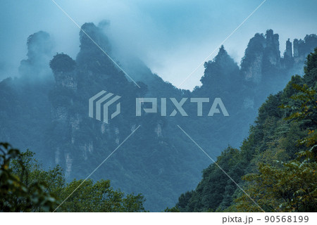 Amazing landscape of mountain and forest in the foggy at Wulingyuan, Hunan, China. Wulingyuan Scenic and Historic Interest Area which was designated a UNESCO World Heritage Site in China Amazing landscape of mountain and forest in the foggy at Wulingyuan, Hunan, China. Wulingyuan Scenic and Historic Interest Area which was designated a UNESCO World Heritage Site in China 90568199
