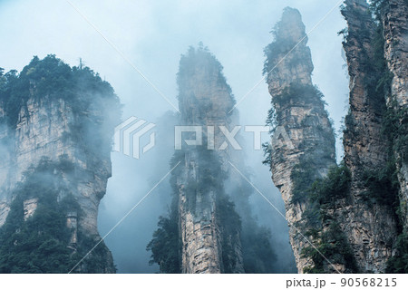 Amazing landscape of mountain and forest in the foggy at Wulingyuan, Hunan, China. Wulingyuan Scenic and Historic Interest Area which was designated a UNESCO World Heritage Site in China Amazing landscape of mountain and forest in the foggy at Wulingyuan, Hunan, China. Wulingyuan Scenic and Historic Interest Area which was designated a UNESCO World Heritage Site in China 90568215