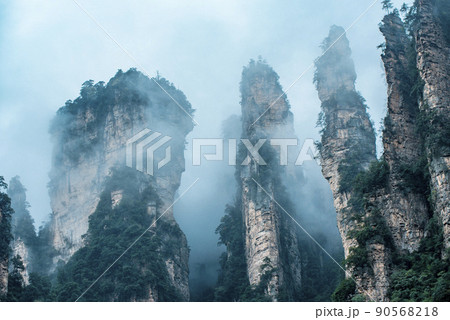 Amazing landscape of mountain and forest in the foggy at Wulingyuan, Hunan, China. Wulingyuan Scenic and Historic Interest Area which was designated a UNESCO World Heritage Site in China Amazing landscape of mountain and forest in the foggy at Wulingyuan, Hunan, China. Wulingyuan Scenic and Historic Interest Area which was designated a UNESCO World Heritage Site in China 90568218