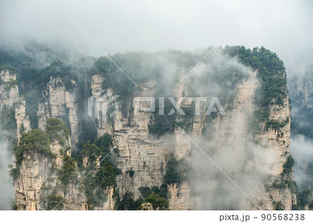 Amazing landscape of mountain and forest in the foggy at Wulingyuan, Hunan, China. Wulingyuan Scenic and Historic Interest Area which was designated a UNESCO World Heritage Site in China 90568238