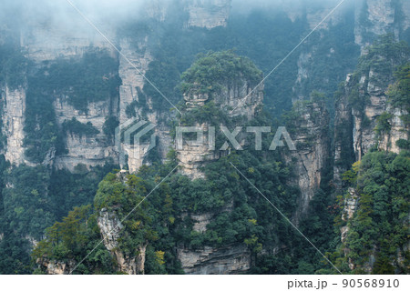 Amazing landscape of mountain and forest in the foggy at Wulingyuan, Hunan, China. Wulingyuan Scenic and Historic Interest Area which was designated a UNESCO World Heritage Site in China 90568910
