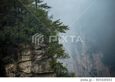 Amazing landscape of mountain and forest in the foggy at Wulingyuan, Hunan, China. Wulingyuan Scenic and Historic Interest Area which was designated a UNESCO World Heritage Site in China 90568983