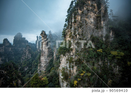 Amazing landscape of mountain and forest in the foggy at Wulingyuan, Hunan, China. Wulingyuan Scenic and Historic Interest Area which was designated a UNESCO World Heritage Site in China Amazing landscape of mountain and forest in the foggy at Wulingyuan, Hunan, China. Wulingyuan Scenic and Historic Interest Area which was designated a UNESCO World Heritage Site in China 90569410