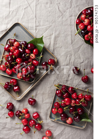 Fresh sweet cherry with green leaves 90574753