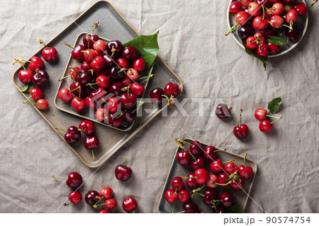Fresh sweet cherry with green leaves 90574754