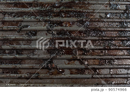 Grill pan with fat deposits after cooking meat. Selective focus, harmful fats, carcinogens 90574966