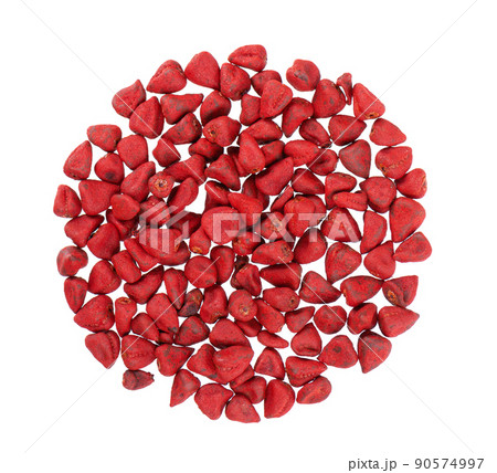 Annatto seeds, isolated on a white background. Achiote seeds, bixa orellana. Natural dye for cooking and food. Close-up. Top view. 90574997