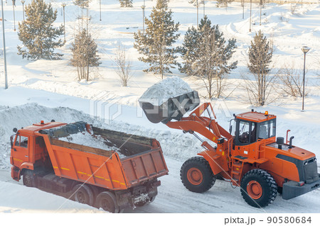 Cleaning and cleaning of roads in the city from snow in winter Cleaning and cleaning of roads in the city from snow in winter 90580684