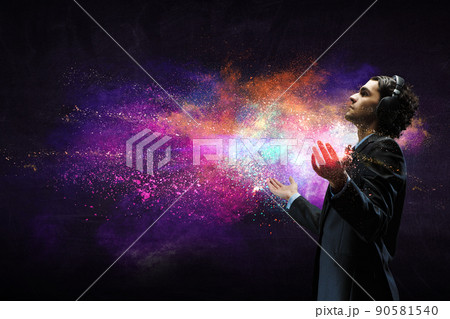 Young businessman with headphones . Mixed media 90581540