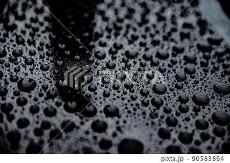 Close up on ideal water drops after rain on car body Close up on ideal water drops after rain on car body 90583864