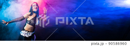 Banner spirituality dance. Beautiful sexy woman with luxury glossy eastern make-up dancing tribal fusion with copy space. Belly dance. 90586960