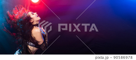 Banner woman belly dancer in exotic dress with gold, dancing tribal fusion dance in studio with copy space 90586978