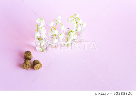 Spring flowers on white background, lily of the valley. Blooming lilies in small glass vases 90588326