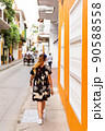 rear view of a latina woman walking in te historic center of Cartagena Colombia 90588558
