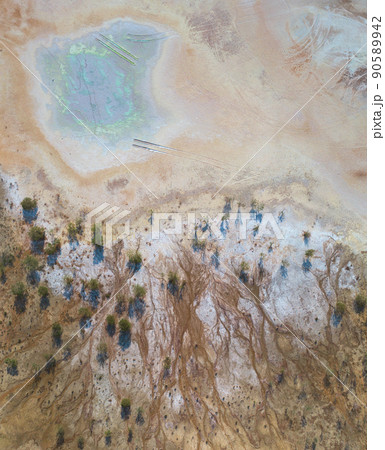 Toxic copper mine dumps surface, aerial view directly above 90589942