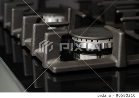 New modern shining metal gas cooker close up New modern shining metal gas cooker close up 90590210