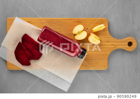 Bottle of fresh beet juice on gray background 90590249