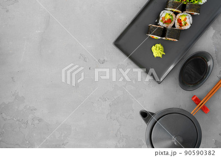 Vegeterian sushi roll with vegetables on gray background Vegeterian sushi roll with vegetables on gray background 90590382