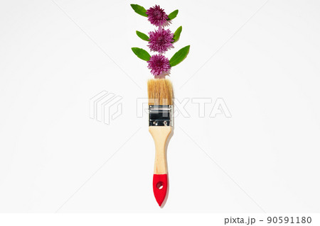 Paint brush and flower buds on white background 90591180
