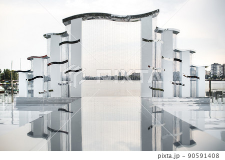 Arch for an outdoor ceremony on the shore of the lake Arch for an outdoor ceremony on the shore of the lake 90591408