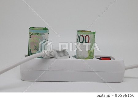 White electric cable and banknotes, expensive electricity, saving electricity. White electric cable and banknotes, expensive electricity, saving electricity. 90596156