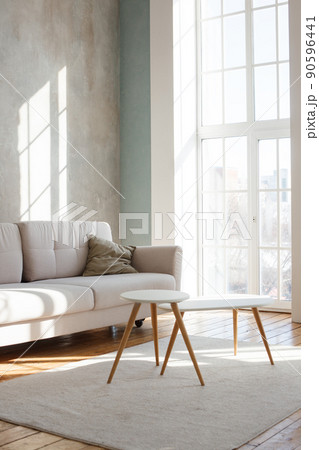 Interior design of stylish living room with modern neutral sofa, Elegant and comfortable designed living room with big corner sofa, wooden floor and big windows. Template. Interior design of stylish living room with modern neutral sofa, Elegant and comfortable designed living room with big corner sofa, wooden floor and big windows. Template. 90596441