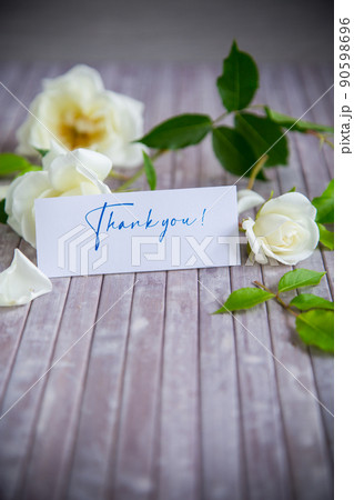 beautiful white summer roses, on a wooden table beautiful white summer roses, on a wooden table 90598696