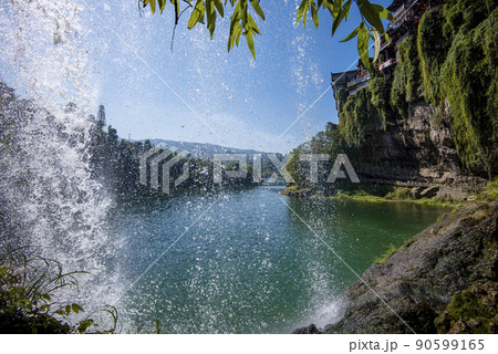 The Wangcun Waterfall at Furong Ancient Town. Amazing beautiful landscape scene of Furong Ancient Town (Furong Zhen, Hibiscus Town), China The Wangcun Waterfall at Furong Ancient Town. Amazing beautiful landscape scene of Furong Ancient Town (Furong Zhen, Hibiscus Town), China 90599165