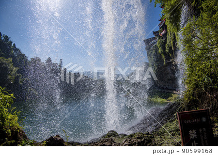 The Wangcun Waterfall at Furong Ancient Town. Amazing beautiful landscape scene of Furong Ancient Town (Furong Zhen, Hibiscus Town), China The Wangcun Waterfall at Furong Ancient Town. Amazing beautiful landscape scene of Furong Ancient Town (Furong Zhen, Hibiscus Town), China 90599168
