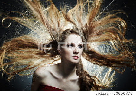 Fashion portrait of the young sexy woman with flying hair Fashion portrait of the young sexy woman with flying hair 90600776