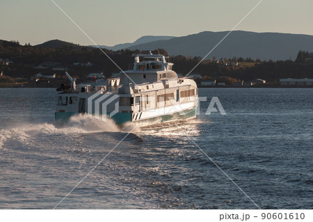 Fast passenger ferry sails the Trondheimsleia strait Fast passenger ferry sails the Trondheimsleia strait 90601610