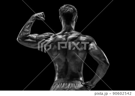Strong Athletic Man Fitness Model posing back muscles, triceps o Strong Athletic Man Fitness Model posing back muscles, triceps o 90602542