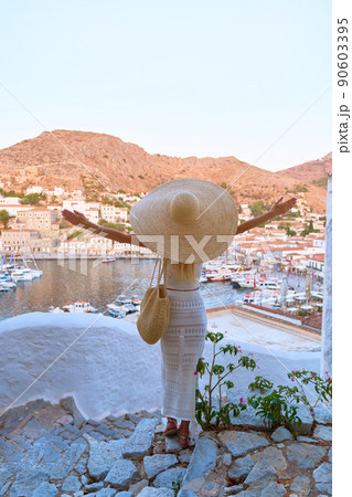 Beautiful girl tourist walking in the streets of Hydra, Greece 90603395