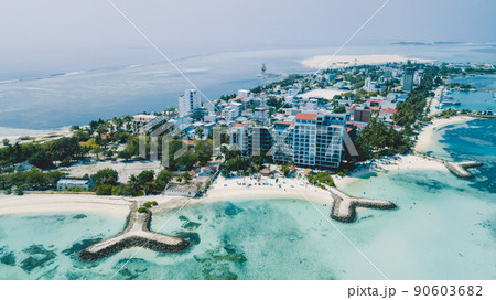 Aerial View to the Maafushi Island with Blue Ocean Water and Paradise Coastline, Maldives 90603682