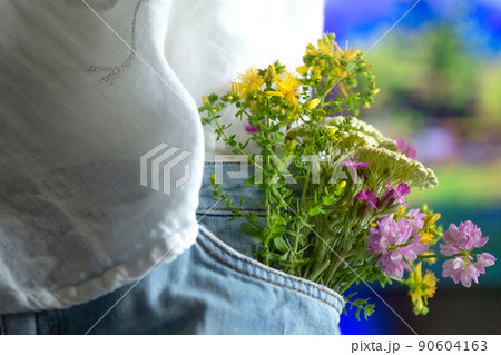 Beautiful tender flowers in front pocket of jeans 90604163