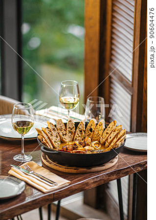 Pan of seafood stew with toasted bread Pan of seafood stew with toasted bread 90604476