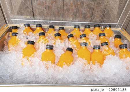 food and drink, orange juice in a bottle with ice food and drink, orange juice in a bottle with ice 90605183