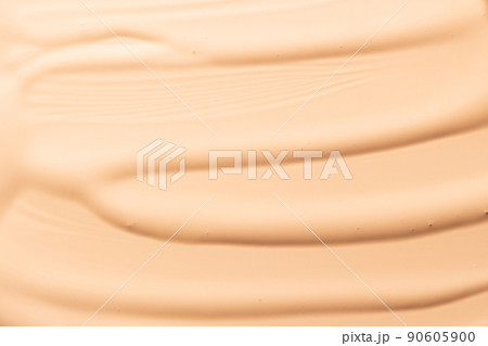 Makeup foundation background. Liquid foundation, concealer brush strokes and face powder. Makeup base, BB, CC cream texture 90605900