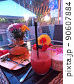 Smoothies burger and flowers in the diner 90607884