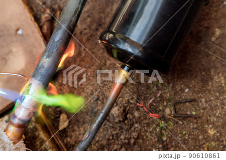 Green flame in copper pipe while joining pipe with fitting Green flame in copper pipe while joining pipe with fitting 90610861