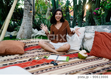 Happy ethnic woman having fun in tropical park Happy ethnic woman having fun in tropical park 90613666