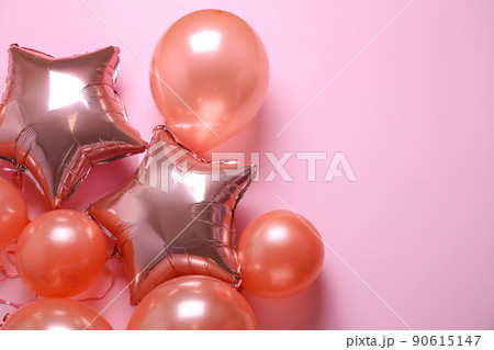 Colorful balloons on pink background, flat lay. Space for text Colorful balloons on pink background, flat lay. Space for text 90615147