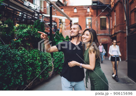 Couple of tourists enjoying travel vacations for exploring city and recreating Couple of tourists enjoying travel vacations for exploring city and recreating 90615696