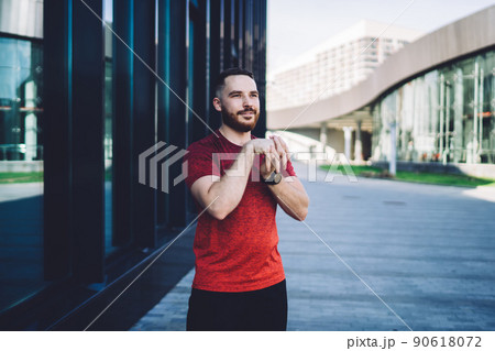 Positive man stretching arms in morning Positive man stretching arms in morning 90618072