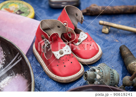 A pair of old retro red children's shoes sandals A pair of old retro red children's shoes sandals 90619241