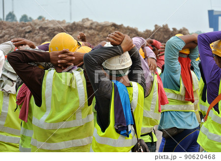 PERAK, MALAYSIA -APRIL 27, 2016: Group of construction workers assemble at the open space in construction site.  90620468